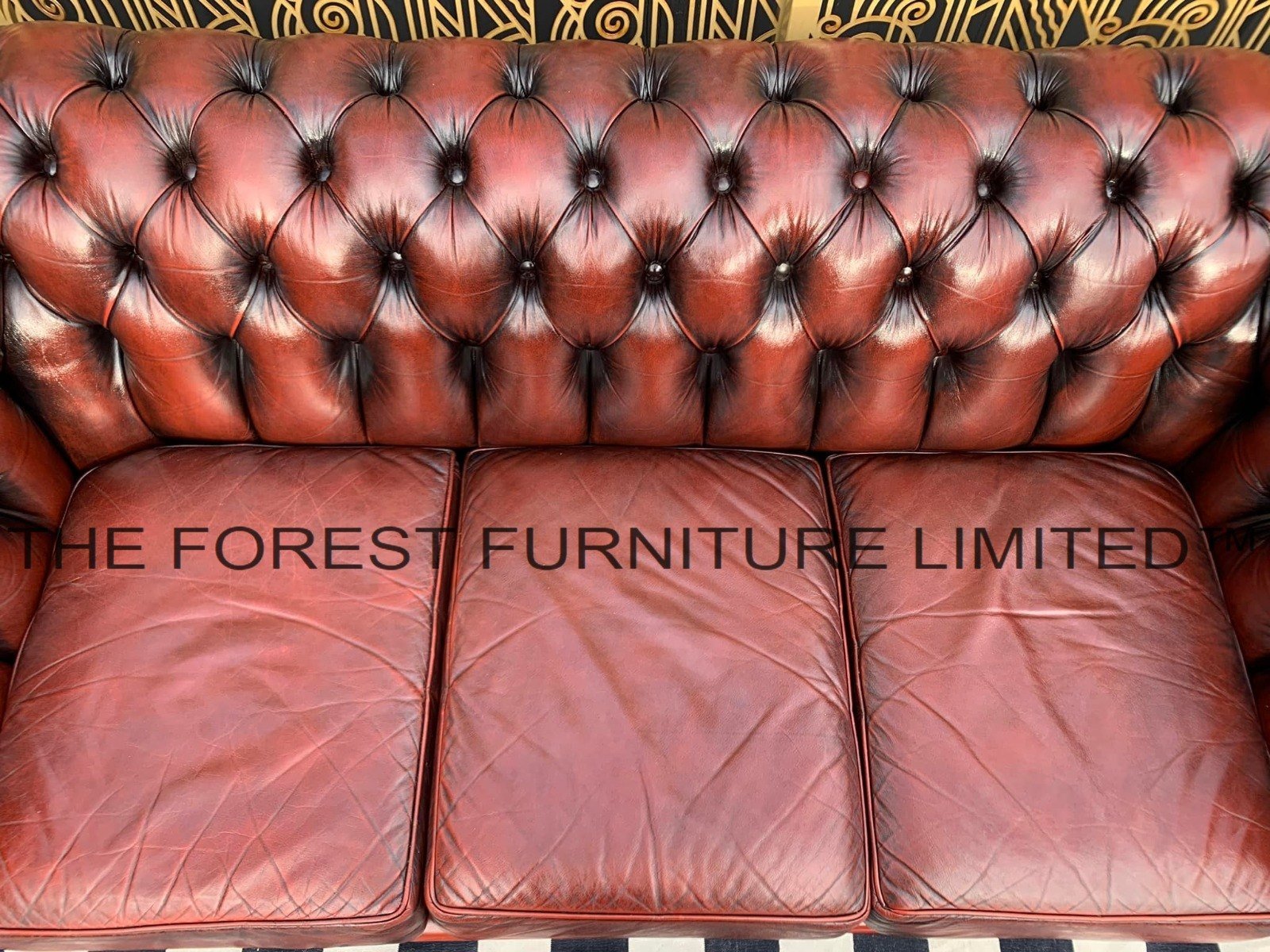 Close-up Royal British Chesterfield tufting and leather craftsmanship detail
